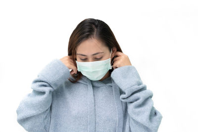 Portrait of a woman covering face