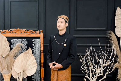 Men wearing traditional javanese clothes