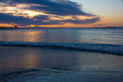 Scenic view of sea against sky during sunset