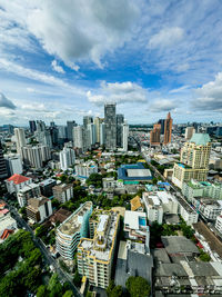 Cityscape against cloudy sky