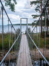 Bridge over sea against sky