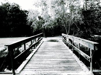 Wooden footbridge over river