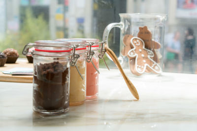 Close-up of food in jars on table
