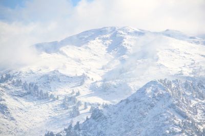 Scenic view of snow covered mountains