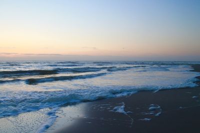 Scenic view of sea at sunset