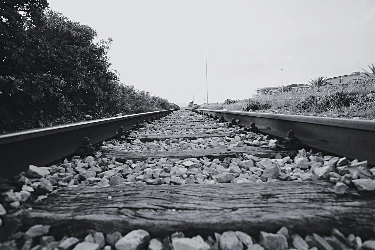 SURFACE LEVEL OF RAILROAD TRACKS AGAINST SKY