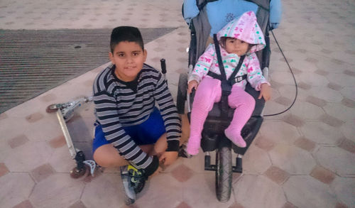 High angle portrait of friends standing on floor