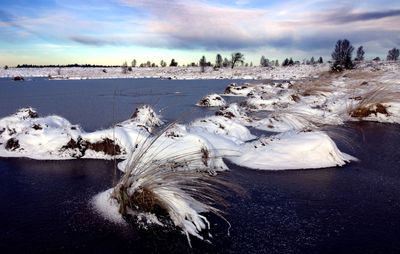 Scenic view of sea against sky during winter