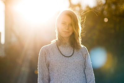 Portrait of beautiful young woman on sunny day