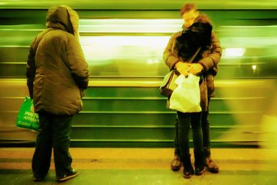 Blurred motion of man in train