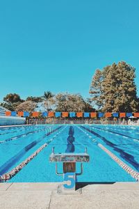 View of swimming pool against clear blue sky