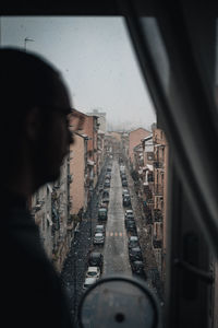 High angle view of cityscape seen through window