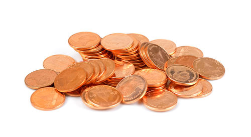 Close-up of coins on white background