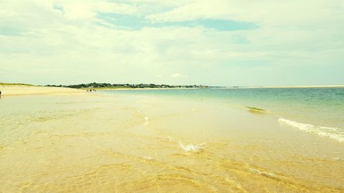 Scenic view of beach against sky