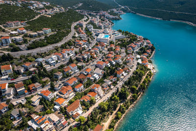 High angle view of townscape by sea