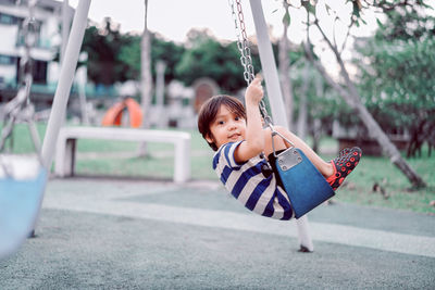 Boy on swing at playground