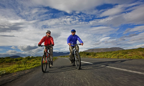 Two friends riding their mountain bikes around lake thingvellir