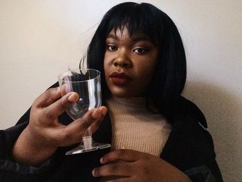 Portrait of woman drinking water