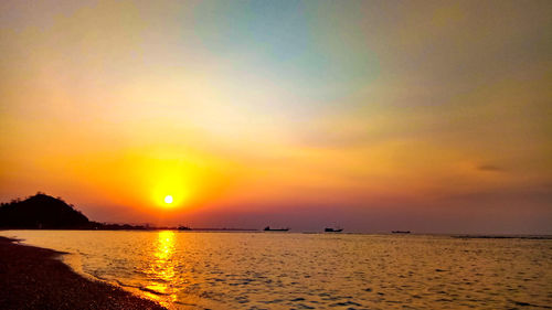 Scenic view of sea against sky during sunset