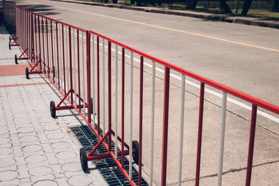 High angle view of metal fence on road