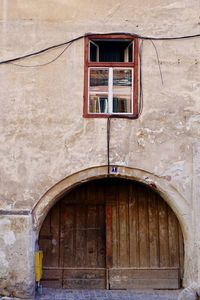 Old door with small window