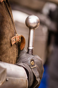 Close-up of man with leather outdoors