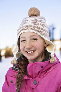 Portrait of happy girl in warm clothing