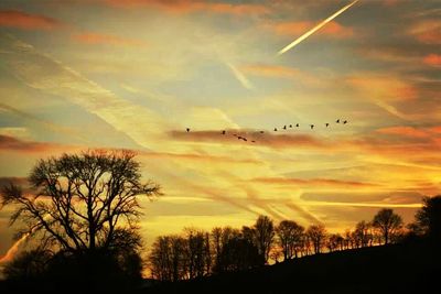 Scenic view of landscape against sky at sunset