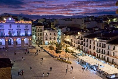 High angle view of buildings in city at night