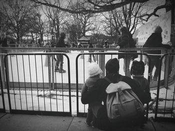 Rear view of woman standing in park