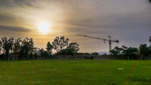 Scenic view of field against sky during sunset