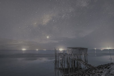 Scenic view of sea against sky at night