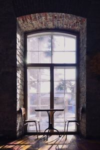 Chairs and table in window