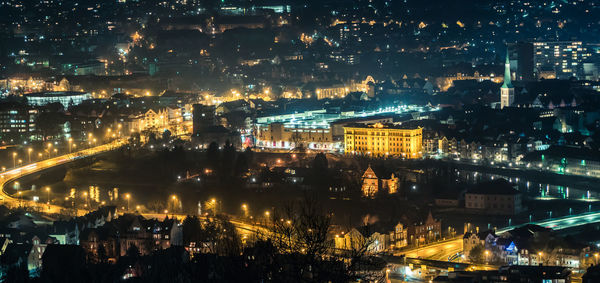 High angle view of illuminated buildings in city at night