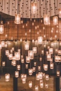 Illuminated electric lights hanging at restaurant