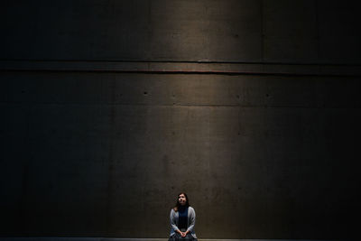 Woman in minimal portrait on the big wall