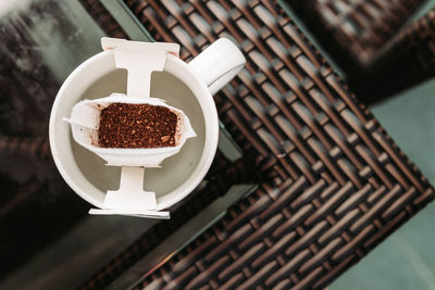 High angle view of coffee cup on table