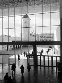 Group of people walking in front of building