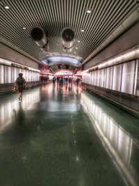People walking on railroad station