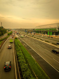 High angle view of vehicles on road against sky during sunset