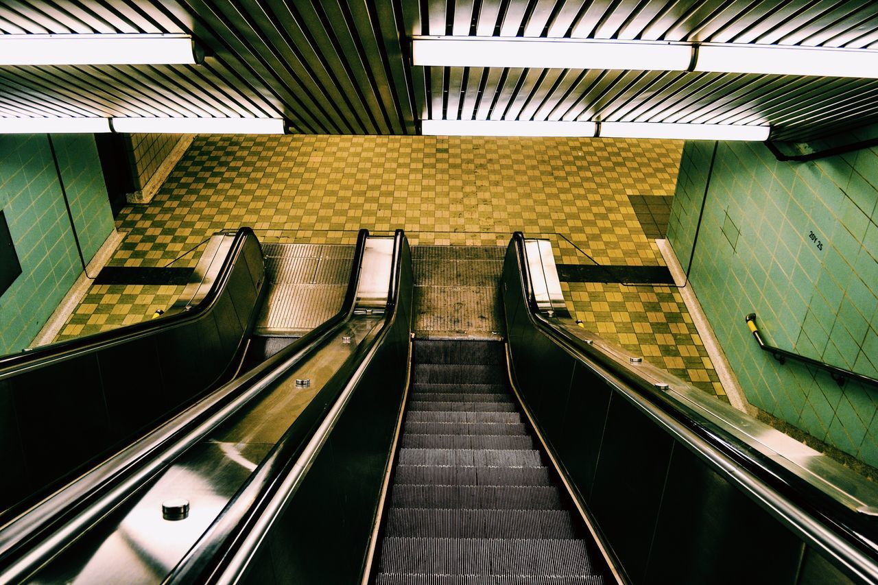 steps, steps and staircases, railing, indoors, high angle view, escalator, modern, staircase, low angle view, technology, ceiling, the way forward, repetition, convenience, architecture, moving up, hand rail, bannister, no people, subway station, building story