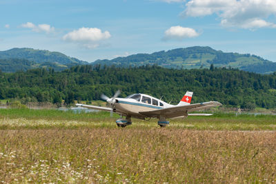 Wangen-lachen, switzerland, may 26, 2024 hb-pkf piper pa-28-236 propeller plane on a small airfield