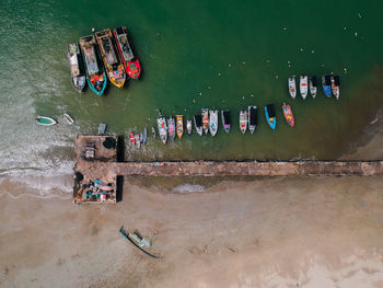 High angle view of graffiti on wall by river