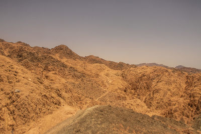 Scenic view of desert against clear sky