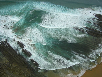 High angle view of surf on beach