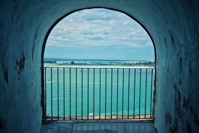 Scenic view of sea against sky seen through window