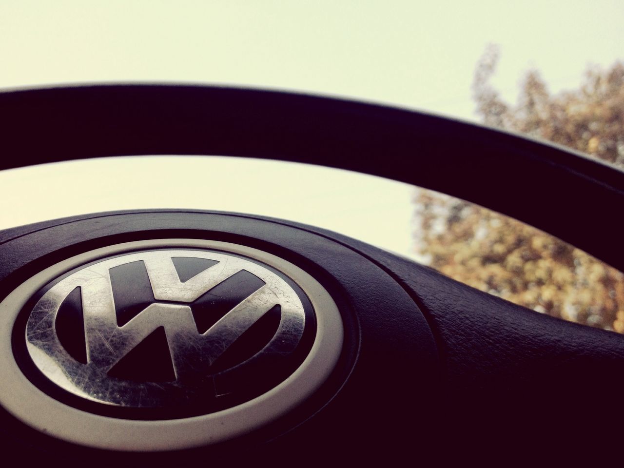 close-up, focus on foreground, part of, transportation, cropped, circle, reflection, selective focus, mode of transport, land vehicle, day, sky, metal, car, outdoors, geometric shape, detail, no people, travel