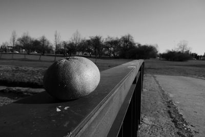 Close-up of ball on field against clear sky