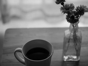 Close-up of coffee cup on table