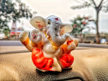 Close-up of stuffed toy on tree